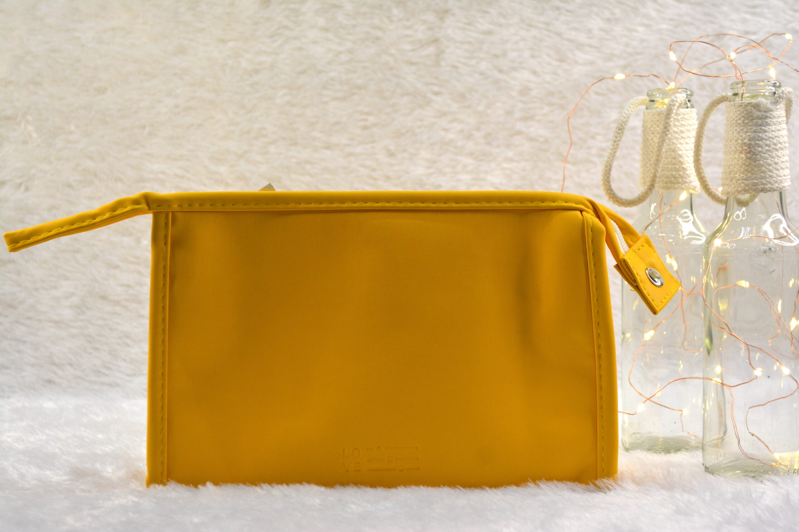 Front view of yellow cosmetic bag